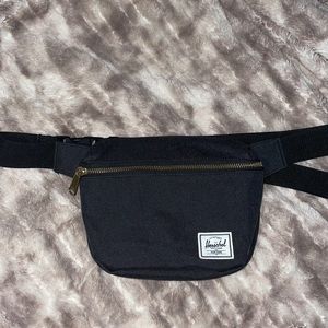 Herschel black Fanny pack/red & white striped interior